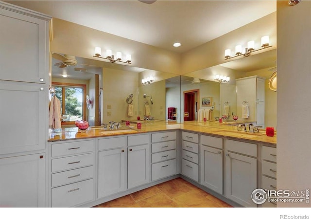 125 Saddleback Ln, Estes Park, CO 80517 - full bathroom with double vanity, tile patterned floors, and recessed lighting