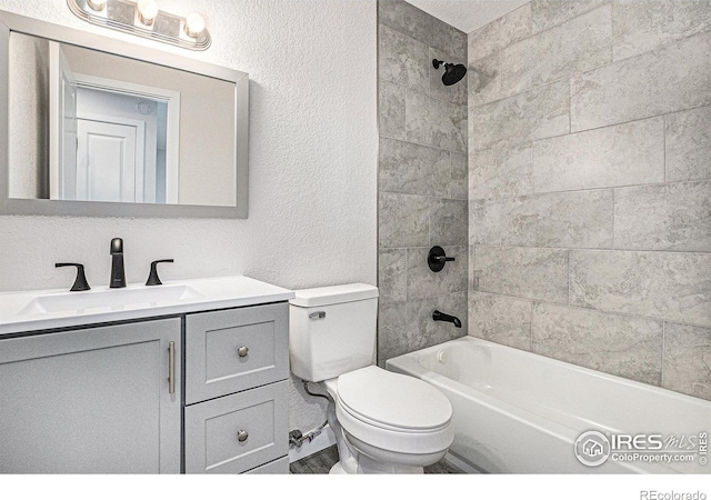 15904 E Bates Pl, Aurora, CO 80013 - full bathroom with a textured wall, toilet, shower / washtub combination, and vanity