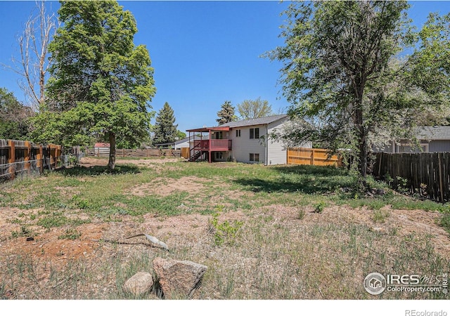 15904 E Bates Pl, Aurora, CO 80013 - fenced backyard with a deck and stairway