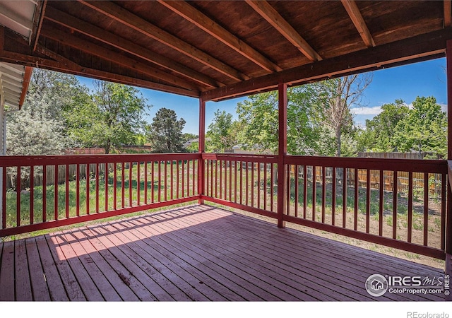 15904 E Bates Pl, Aurora, CO 80013 - wooden deck with a fenced backyard and view of scattered trees