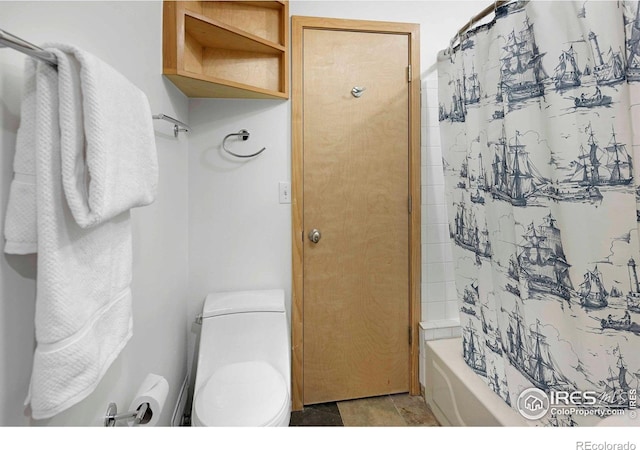 398 Fred Rd, Boulder, CO 80302 - bathroom featuring shower / bath combination with curtain, toilet, and stone finish floors