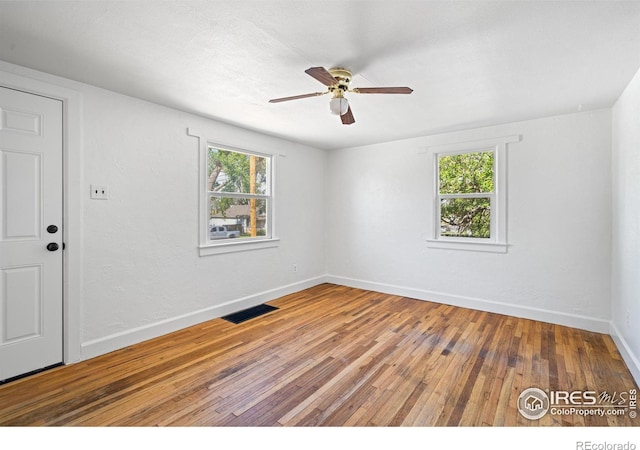 618 16th St, Greeley, CO 80631 - spare room with wood-type flooring, ceiling fan, and baseboards