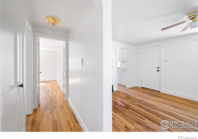 618 16th St, Greeley, CO 80631 - hallway featuring light wood finished floors and baseboards