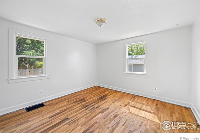 618 16th St, Greeley, CO 80631 - unfurnished room featuring wood-type flooring and baseboards