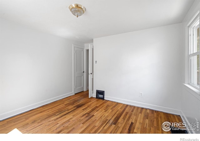 618 16th St, Greeley, CO 80631 - empty room featuring light wood-style floors and baseboards