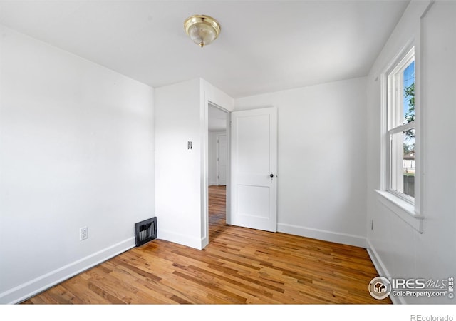 618 16th St, Greeley, CO 80631 - spare room featuring light wood-style floors and baseboards