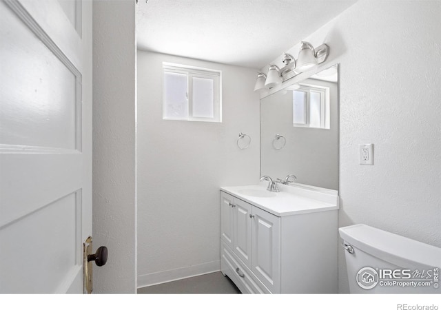 618 16th St, Greeley, CO 80631 - bathroom with vanity and toilet