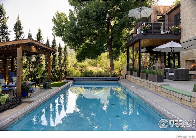 3737 Spring Valley Rd, Boulder, CO 80304 - outdoor pool with an outdoor living space, a patio, and a deck