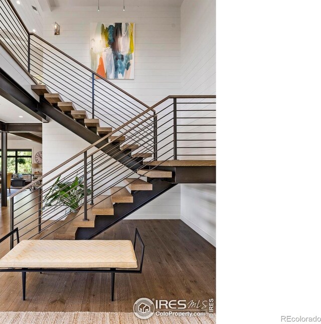 3737 Spring Valley Rd, Boulder, CO 80304 - staircase featuring wood finished floors, wooden walls, and recessed lighting