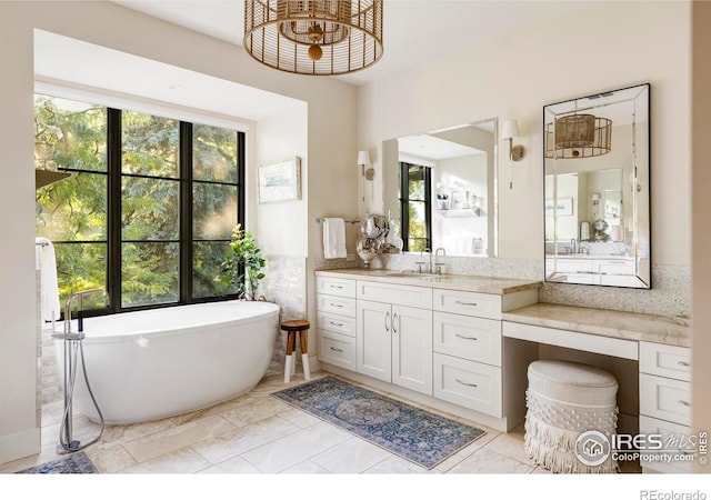 3737 Spring Valley Rd, Boulder, CO 80304 - bathroom with plenty of natural light, a freestanding tub, and vanity