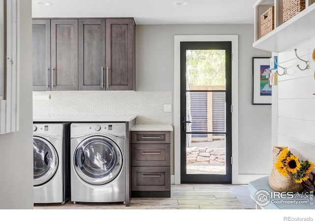 3737 Spring Valley Rd, Boulder, CO 80304 - laundry room featuring cabinet space, washer and dryer, and light wood-style flooring