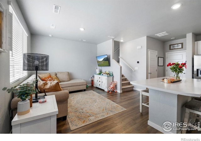 253 Molinar St, Johnstown, CO 80534 - living room featuring stairs, dark wood-style flooring, recessed lighting, and baseboards