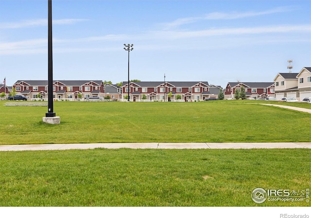 253 Molinar St, Johnstown, CO 80534 - view of community featuring a residential view and a yard