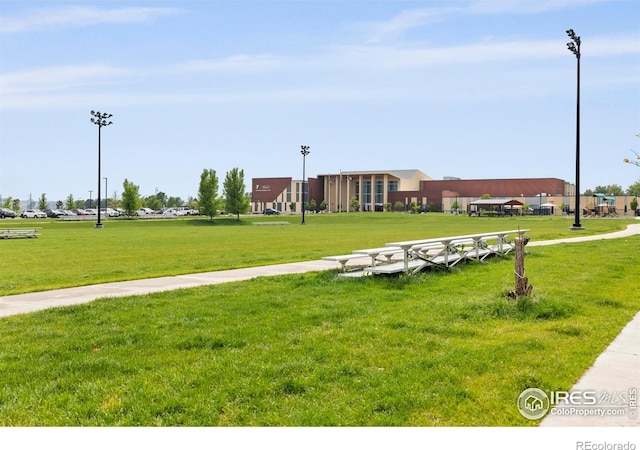 253 Molinar St, Johnstown, CO 80534 - view of home's community with a lawn