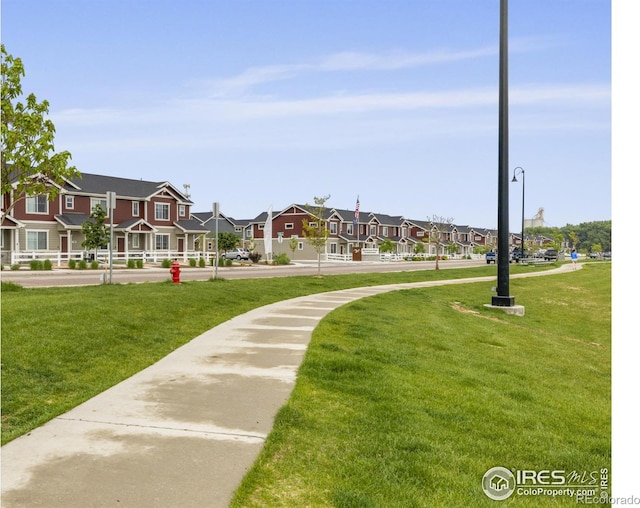 253 Molinar St, Johnstown, CO 80534 - view of home's community featuring a residential view and a lawn