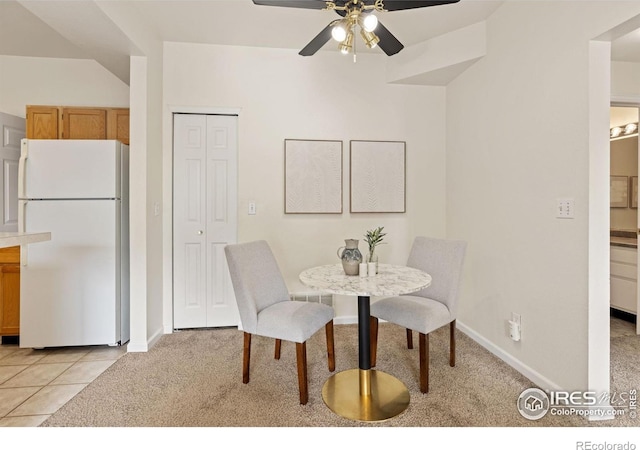 4545 Wheaton Dr Unit A-290, Fort Collins, CO 80525 - dining space with light colored carpet, a ceiling fan, and baseboards