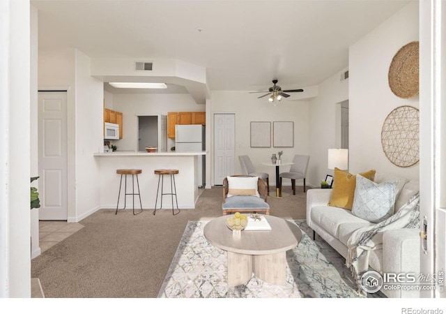 4545 Wheaton Dr Unit A-290, Fort Collins, CO 80525 - living room featuring light colored carpet, ceiling fan, and baseboards