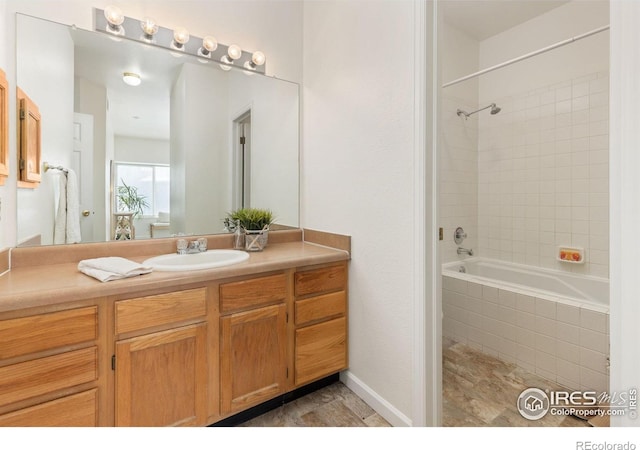 4545 Wheaton Dr Unit A-290, Fort Collins, CO 80525 - bathroom featuring tiled shower / bath and vanity