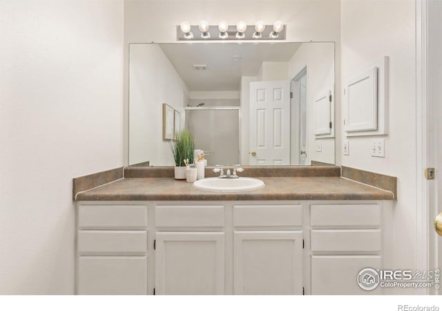 4545 Wheaton Dr Unit A-290, Fort Collins, CO 80525 - bathroom featuring vanity and a shower stall