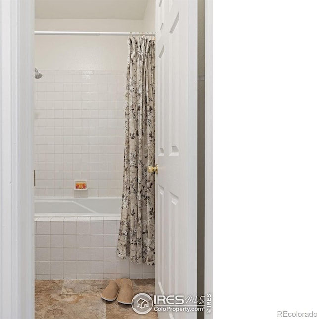 4545 Wheaton Dr Unit A-290, Fort Collins, CO 80525 - bathroom featuring tiled shower / bath