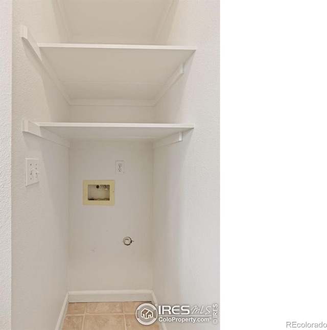 4545 Wheaton Dr Unit A-290, Fort Collins, CO 80525 - laundry area featuring hookup for a washing machine, baseboards, and tile patterned flooring