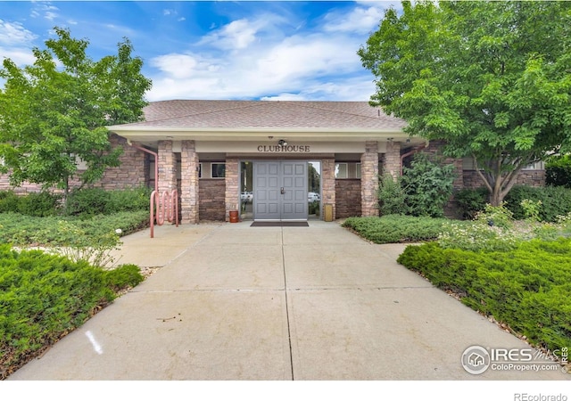 4545 Wheaton Dr Unit A-290, Fort Collins, CO 80525 - view of front of property featuring driveway and roof with shingles