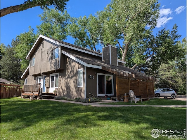 1012 Driftwood Dr, Fort Collins, CO 80525 - back of property featuring a chimney and a wooden deck