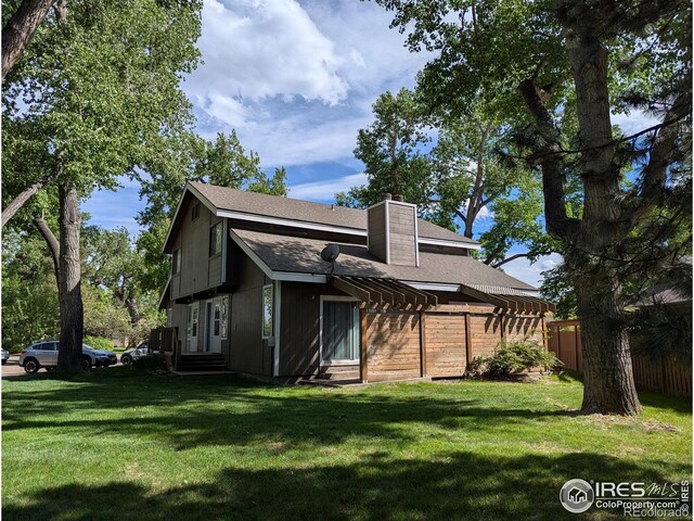 1012 Driftwood Dr, Fort Collins, CO 80525 - rear view of house with a chimney, a shingled roof, and entry steps