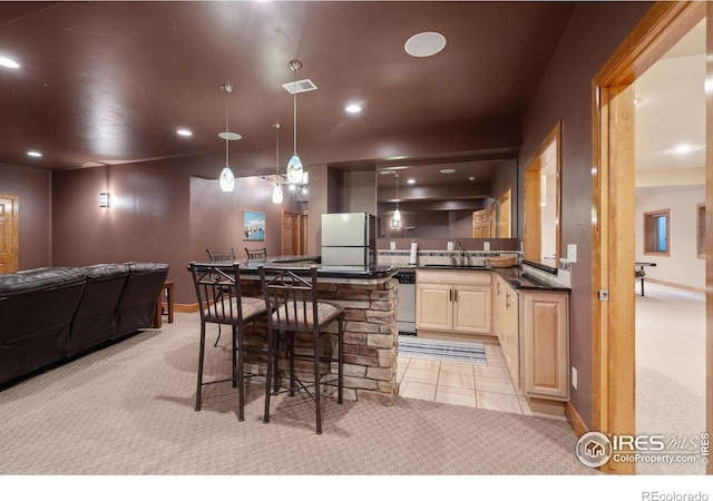5025 Eagle Lake Dr, Fort Collins, CO 80524 - kitchen featuring freestanding refrigerator, light colored carpet, a sink, dishwasher, and dark countertops