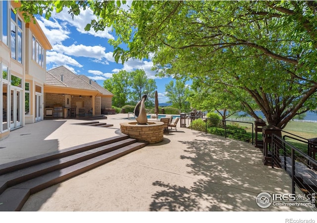 5025 Eagle Lake Dr, Fort Collins, CO 80524 - view of patio / terrace featuring a fire pit