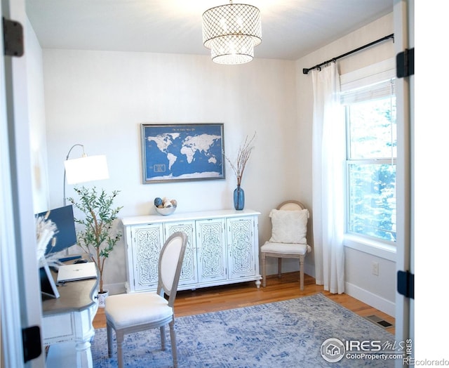 6523 Spanish Bay Dr, Windsor, CO 80550 - home office with wood finished floors and baseboards