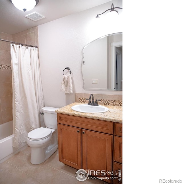 6523 Spanish Bay Dr, Windsor, CO 80550 - full bathroom featuring toilet, vanity, tile patterned flooring, and shower / tub combo