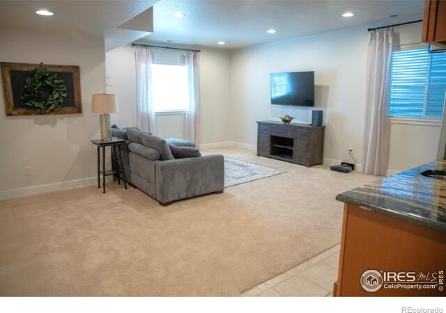 6523 Spanish Bay Dr, Windsor, CO 80550 - living room featuring light carpet, recessed lighting, and baseboards