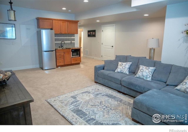 6523 Spanish Bay Dr, Windsor, CO 80550 - living area featuring recessed lighting, light carpet, and baseboards