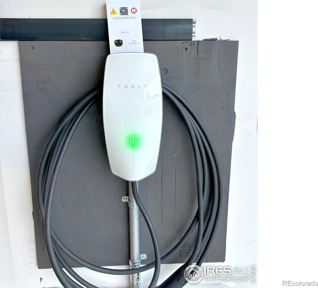 6523 Spanish Bay Dr, Windsor, CO 80550 - garage view of electric vehicle charger