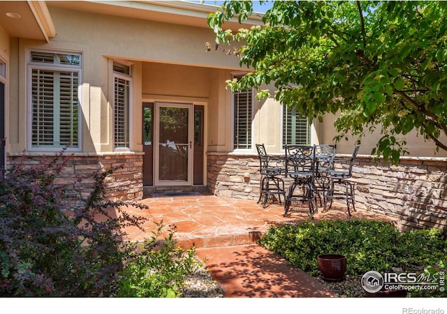6535 Half Moon Bay Dr, Windsor, CO 80550 - view of patio featuring outdoor dining area