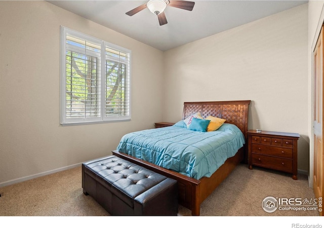6535 Half Moon Bay Dr, Windsor, CO 80550 - carpeted bedroom with baseboards and a ceiling fan