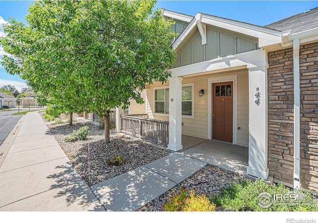 4751 Pleasant Oak Dr Unit B44, Fort Collins, CO 80525 - entrance to property with a porch, board and batten siding, and brick siding