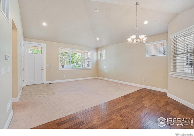 4751 Pleasant Oak Dr Unit B44, Fort Collins, CO 80525 - foyer entrance featuring a chandelier, wood finished floors, recessed lighting, vaulted ceiling, and baseboards