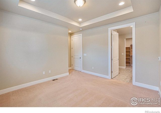 4751 Pleasant Oak Dr Unit B44, Fort Collins, CO 80525 - unfurnished bedroom featuring light carpet, a tray ceiling, recessed lighting, and baseboards