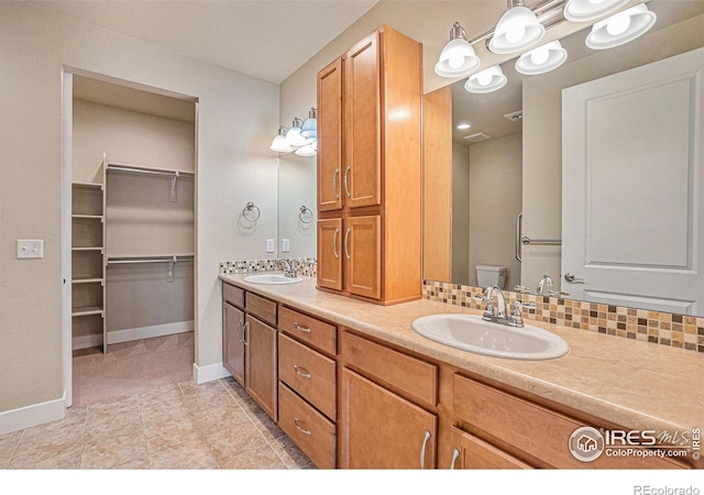 4751 Pleasant Oak Dr Unit B44, Fort Collins, CO 80525 - full bathroom with double vanity, baseboards, and toilet