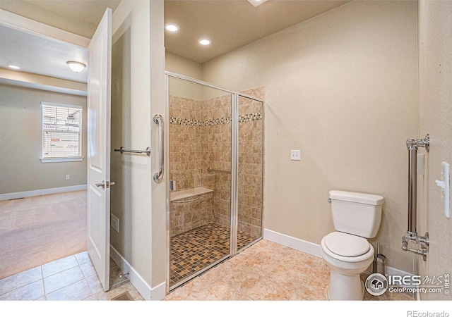 4751 Pleasant Oak Dr Unit B44, Fort Collins, CO 80525 - bathroom featuring toilet, a stall shower, tile patterned floors, baseboards, and recessed lighting