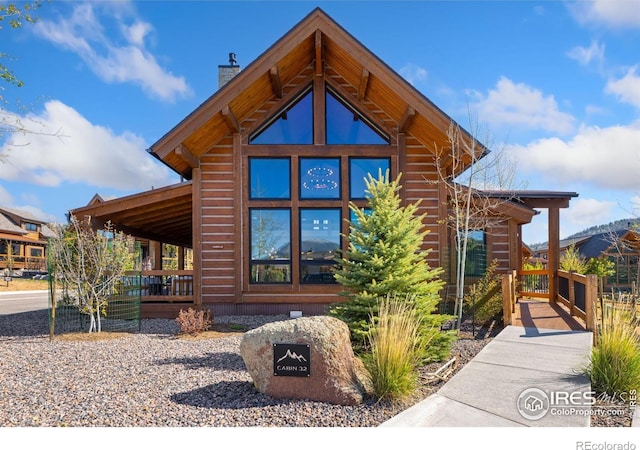 1722 Theater Way, Estes Park, CO 80517 - view of home's exterior featuring a chimney and a porch