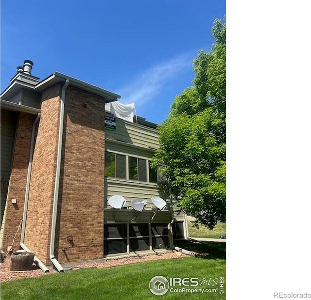 50 19th Ave Unit 9, Longmont, CO 80501 - view of property exterior with brick siding