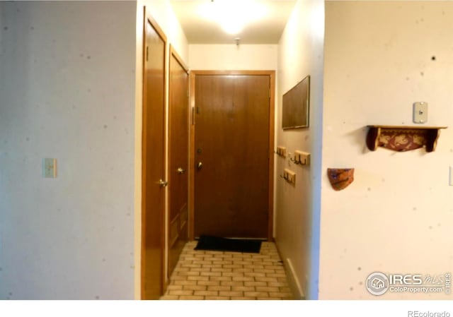 50 19th Ave Unit 9, Longmont, CO 80501 - doorway to outside with brick patterned flooring and baseboards