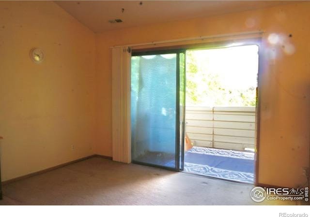 50 19th Ave Unit 9, Longmont, CO 80501 - carpeted empty room with baseboards and lofted ceiling