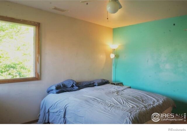 50 19th Ave Unit 9, Longmont, CO 80501 - bedroom with a ceiling fan