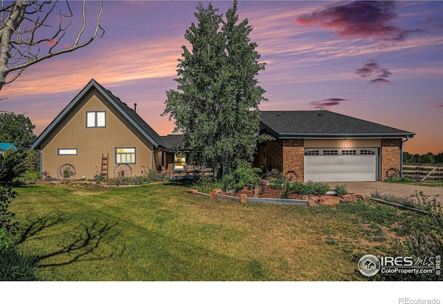 3412 Erving Ct, Berthoud, CO 80513 - view of front of house with driveway, an attached garage, and brick siding