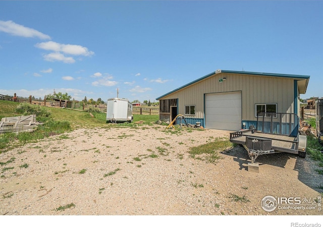 3412 Erving Ct, Berthoud, CO 80513 - exterior space with an outbuilding, a garage, and dirt driveway