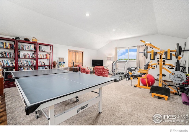 3412 Erving Ct, Berthoud, CO 80513 - recreation room featuring vaulted ceiling, a textured ceiling, and carpet